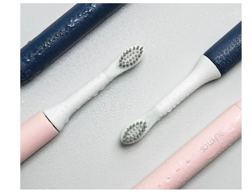 Sonic electric toothbrush with round brush head in blue, IPX7 waterproof handle with power button