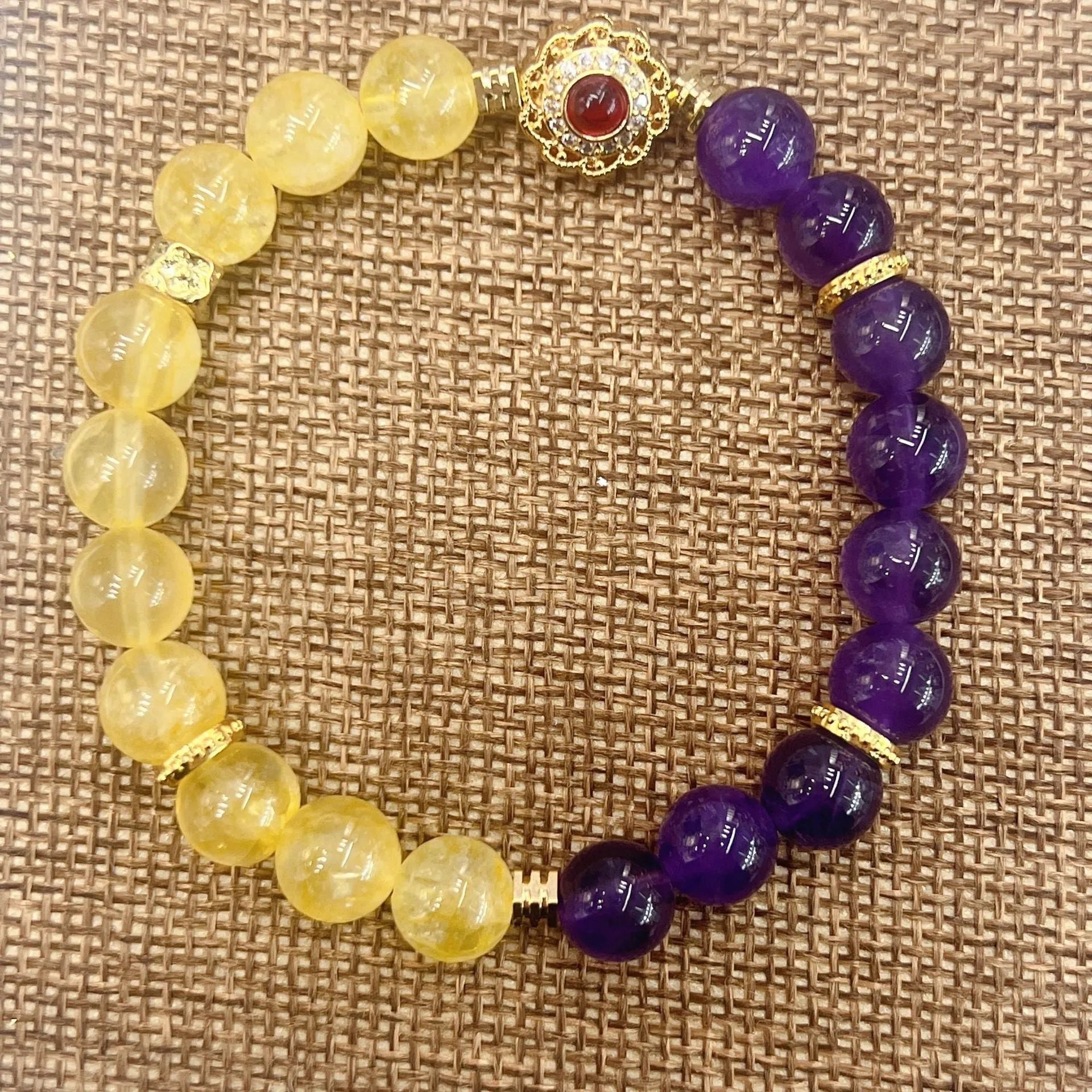 Handmade women's bracelet with yellow and purple amethyst crystal beads
