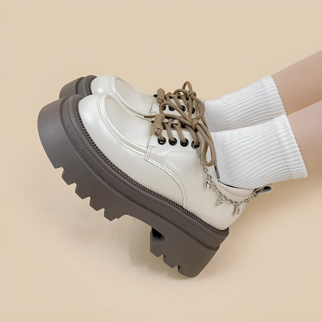 White women's platform Mary Jane shoes with chunky heel and front lace-up fastening.