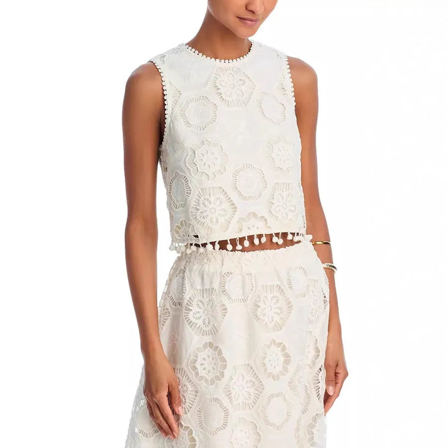 White women's sleeveless suit top with matching embroidered long skirt set