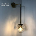 Modern glass bedside wall lamp in golden flower finish with 20cm diameter