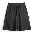 Cement grey American-style sport shorts with loose profile and straight-cut design for athletic wear