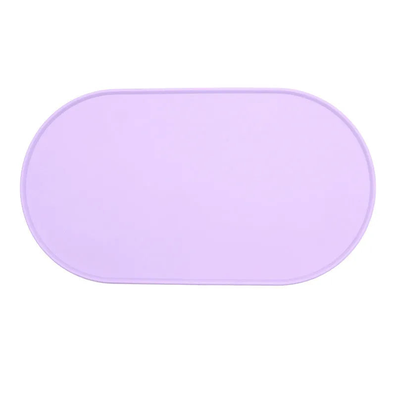 Silicone waterproof placemat for cat food and water bowls in beige, showing its size next to a bowl.