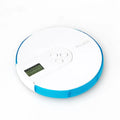 Seven compartment alarm clock pill dispenser showing medication compartments and display