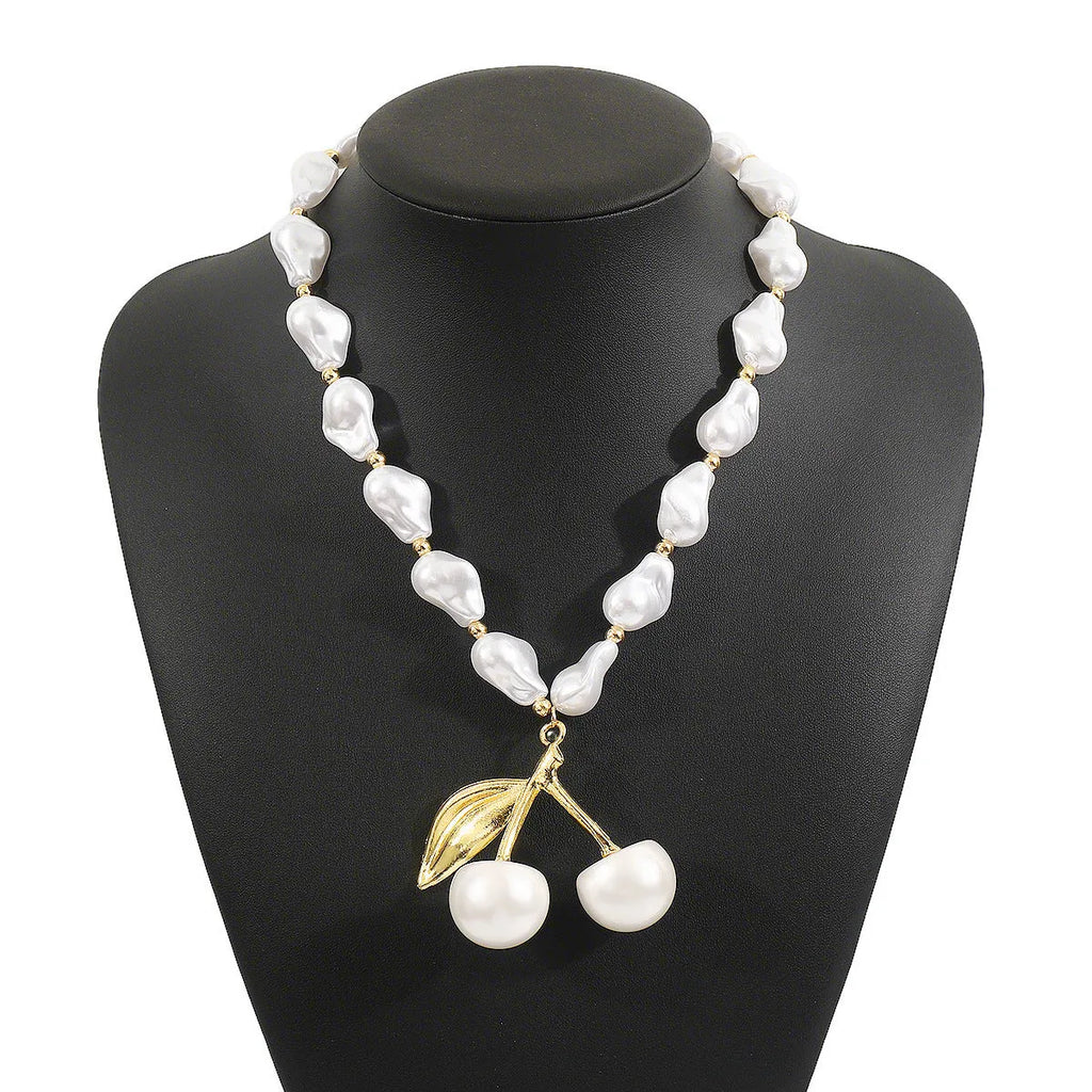 Women's adjustable pearl cherry fruit necklace with gold electroplated finish showing fruit pendant details