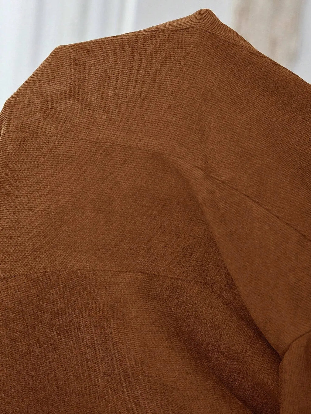 Brown single-breasted men's leisure suit coat with lapel collar and long sleeves