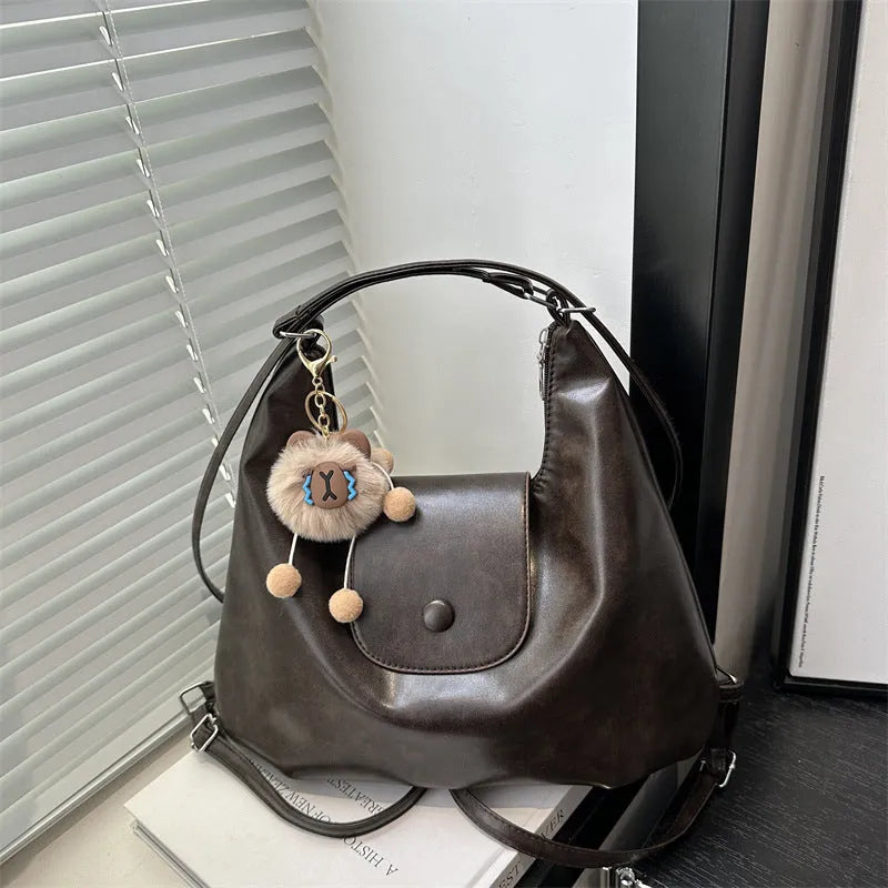 Women's PU leather single shoulder bag in horizontal square shape with optional pendant