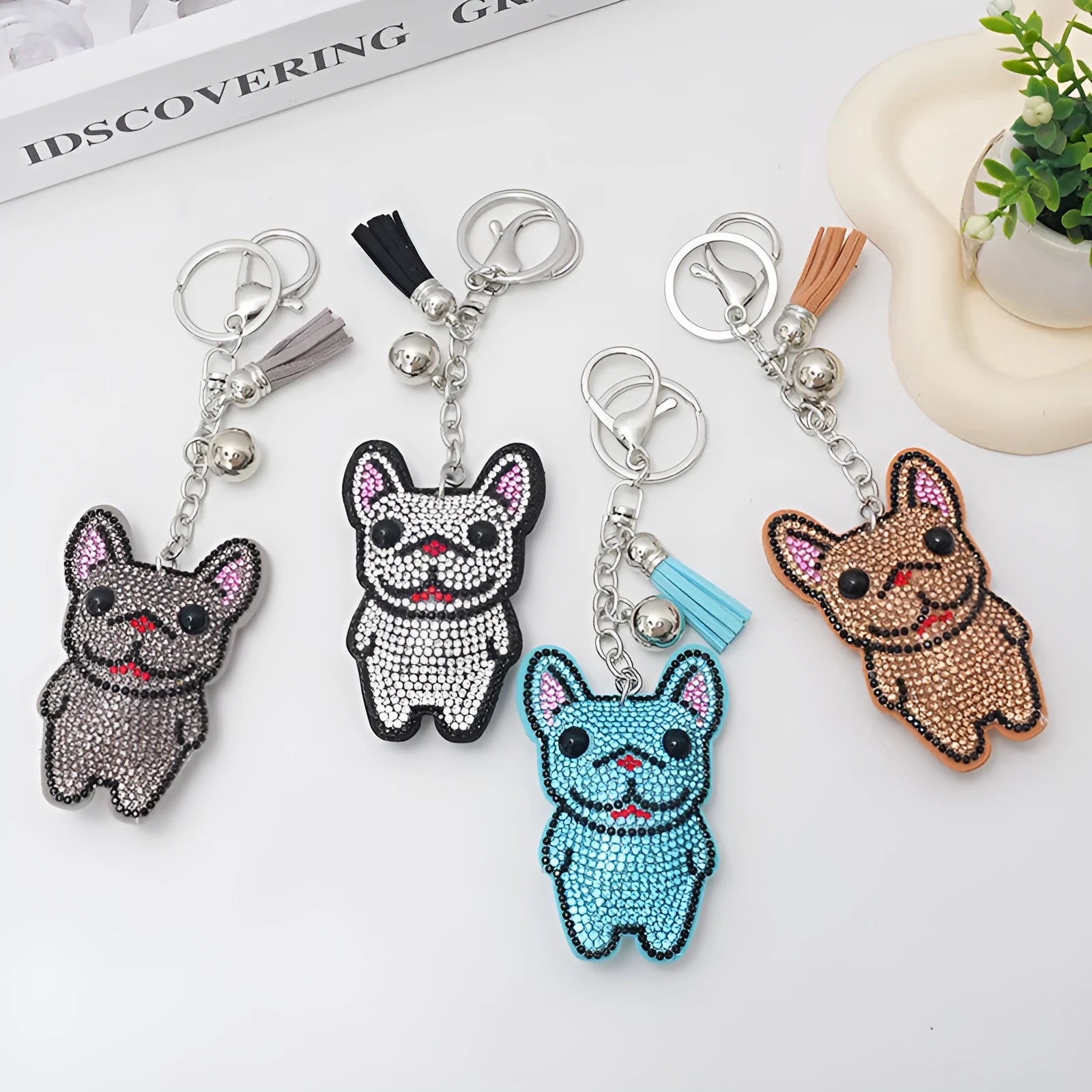 Cartoon French dog rhinestone keychain in alloy with electroplated finish.