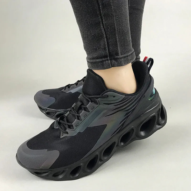 Men's black breathable low-top casual sports shoes with mesh upper and white EVA sole on a plain background.