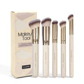 MAANGE set of five apricot-coloured makeup brushes with angled blusher brush on a white background.