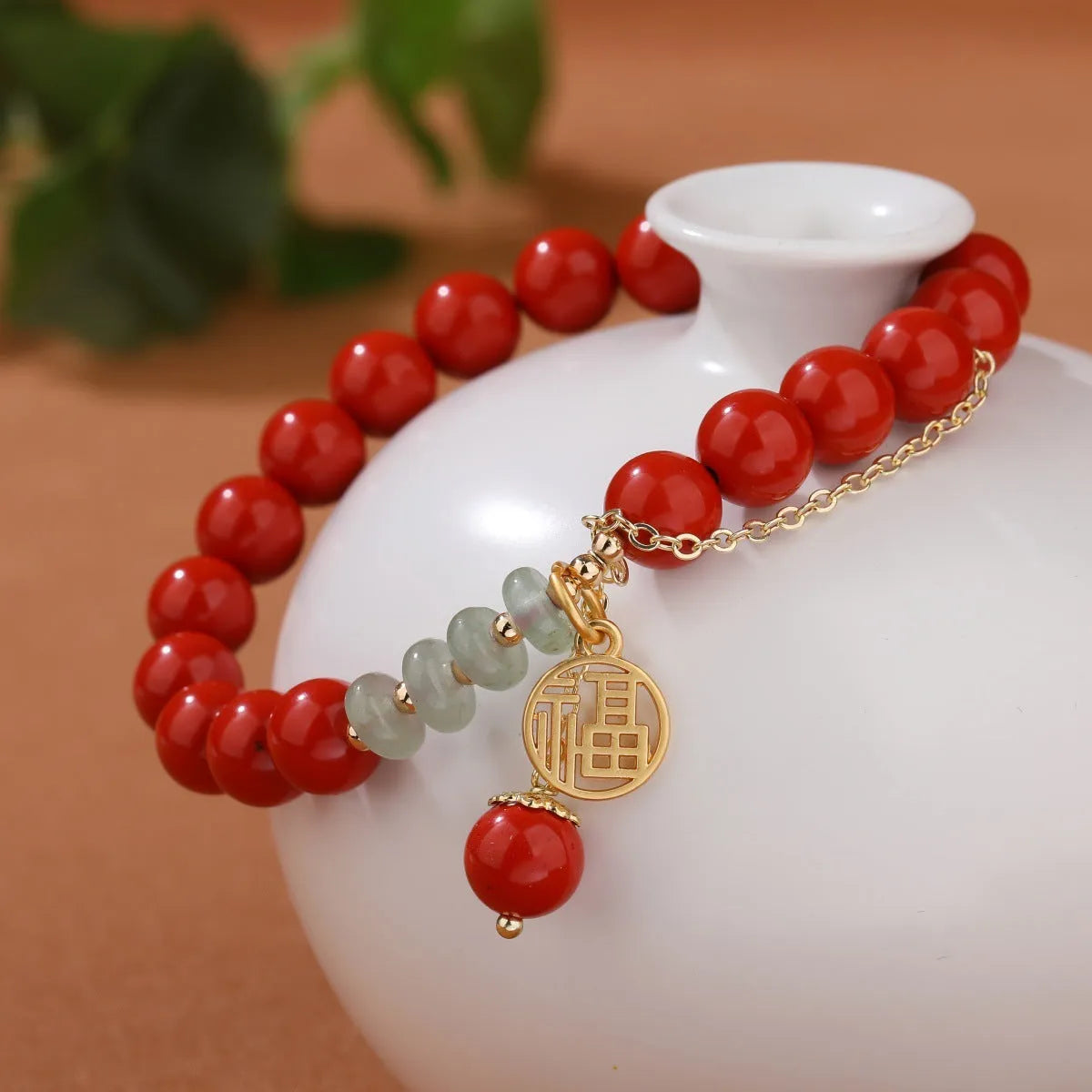 Retro women's red sand cinnabar bracelet with jade spacers and Fu character tassel, 8mm beads