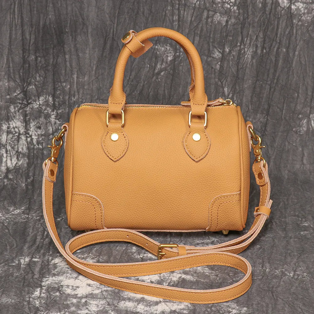 New handmade first layer cowhide Boston bag in brown yellow with sewing thread detailing, single shoulder strap, and open outer pocket