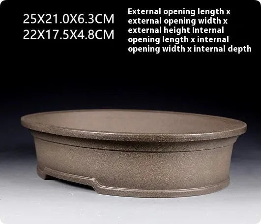 Handmade antique oval bonsai pot in purple sand ceramic measuring 25cm long by 21cm wide