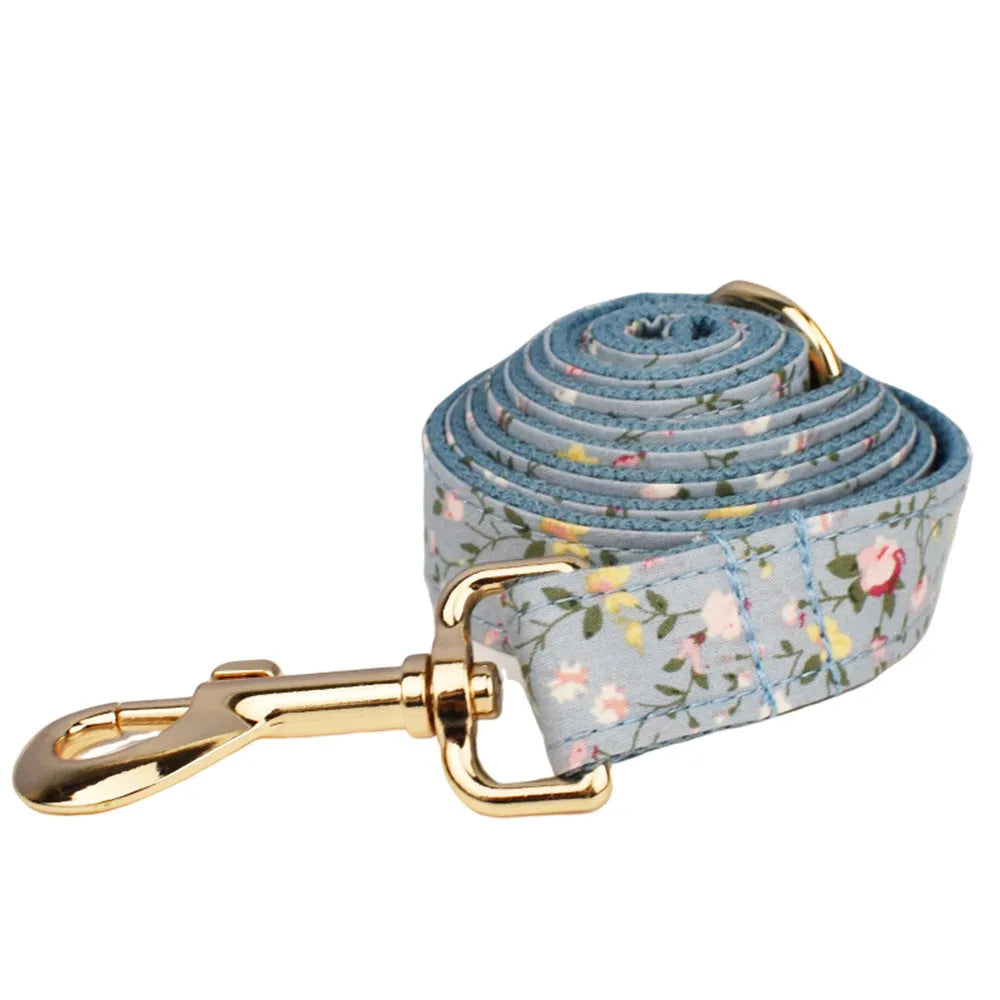 Blue floral polyester cotton dog collar and matching accessory set including leash, vest, bow tie, and waste bag