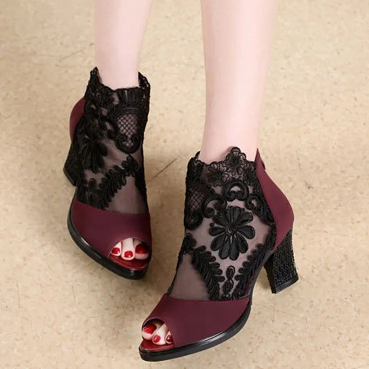 Lucyever women's black lace gladiator sandals with a zip closure and square high heel on a white background.