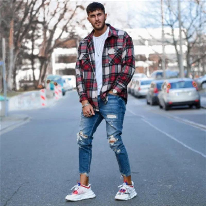 Men's distressed jeans with holes in deep blue cotton denim fabric
