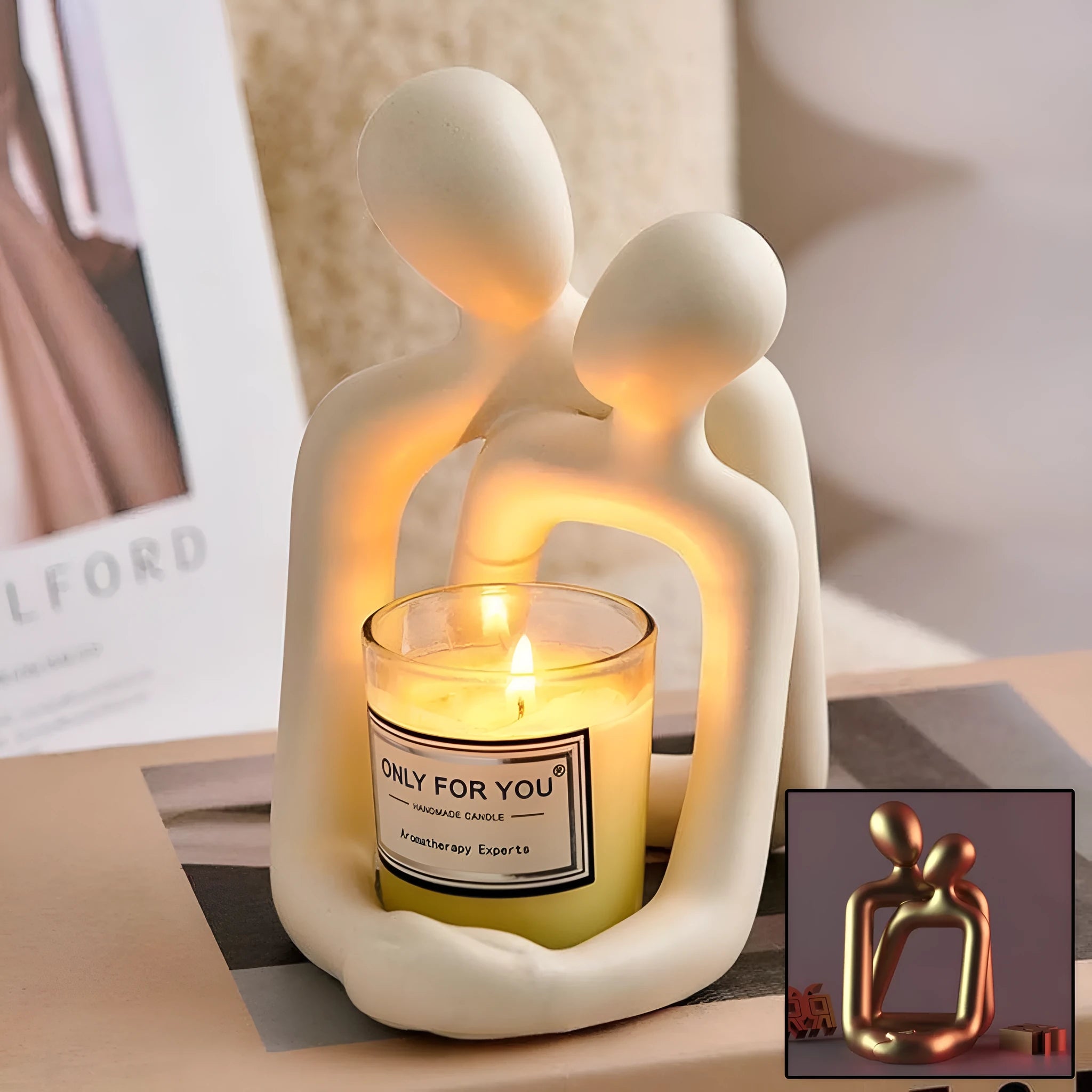 Modern couple resin statue in gold colour placed on a white bookshelf as home decor accent