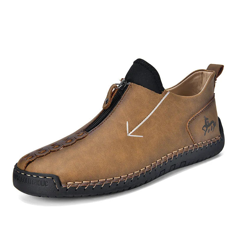 Men's brown leather-look martin boots with a front zipper and round toe on a rubber sole.