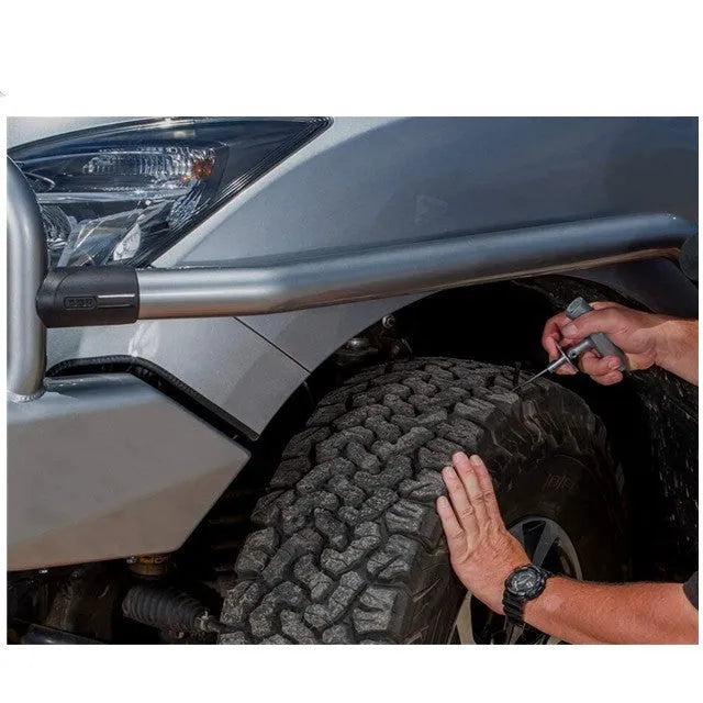 Speedy Seal emergency car tyre repair tool kit open in its high-visibility case, showing pressure gauge, reamer, and insertion tools.