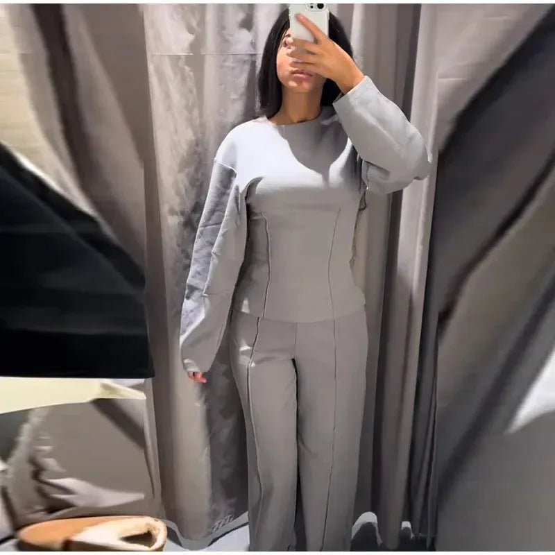 Women's polar fleece suit set showing long sleeve O-neck top with wide leg trousers in multiple colour options