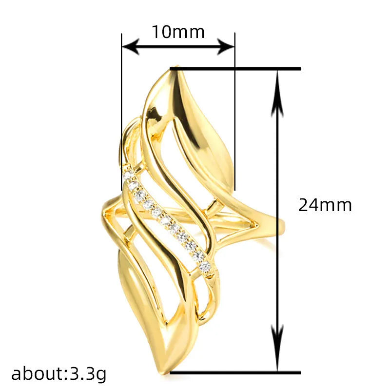 Gold tone exaggerated curve copper ring with zircon stone on white background