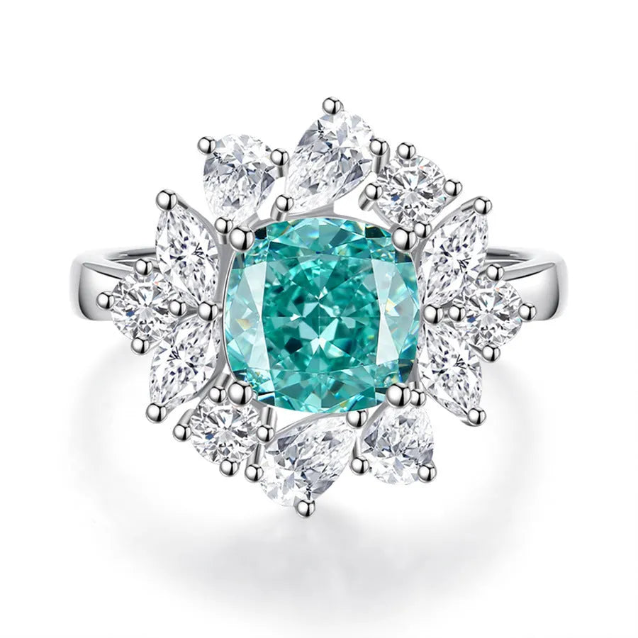 S925 sterling silver ring with a green emerald in a geometric Palaibahao setting on a woman's finger.
