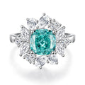 S925 sterling silver ring with a green emerald in a geometric Palaibahao setting on a woman's finger.
