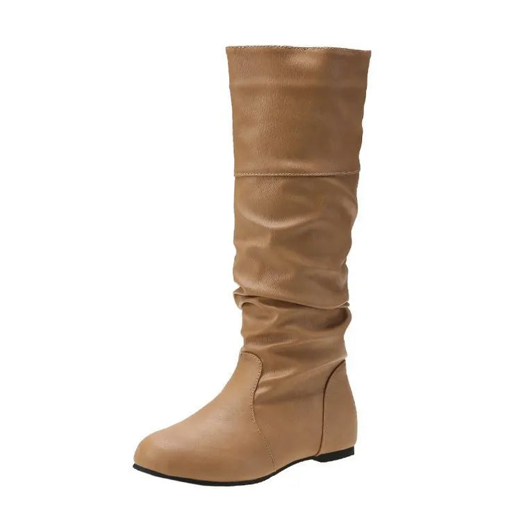 Women's flat heel slip-on boots in black with a round toe and high calf shaft, made from artificial PU with a rubber sole.