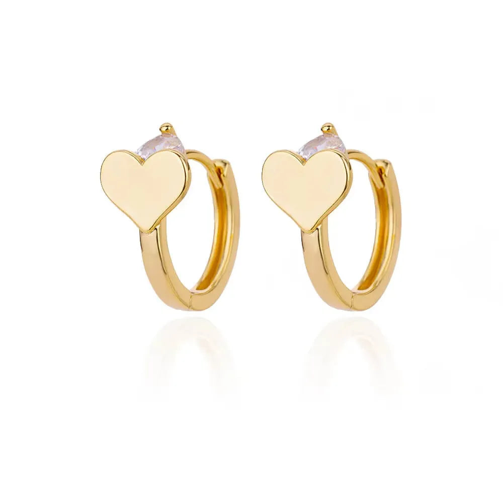 Silver heart-shaped stainless steel clip-on stud earrings with a central zircon stone.