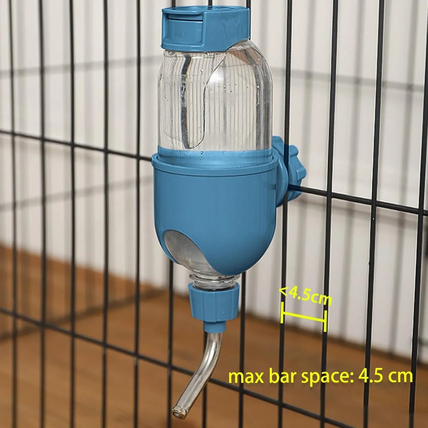 Small animal water bottle with rotating nozzle mounted on cage, shown in blue colour with 500ml capacity marking