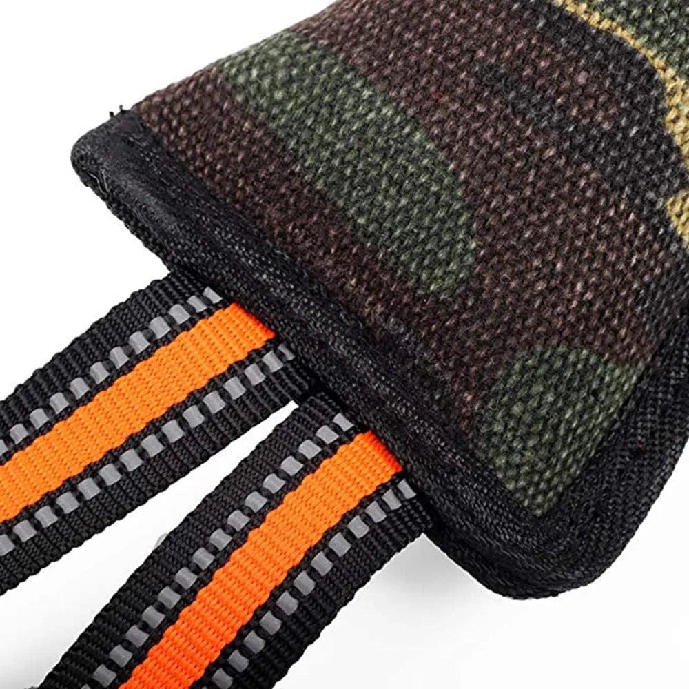 Reflective dog training bite stick with jute surface and yellow edge, 55cm total length, on outdoor ground