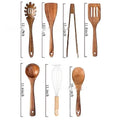 Wooden kitchen utensil set containing seven pieces including spatula and soup spoons