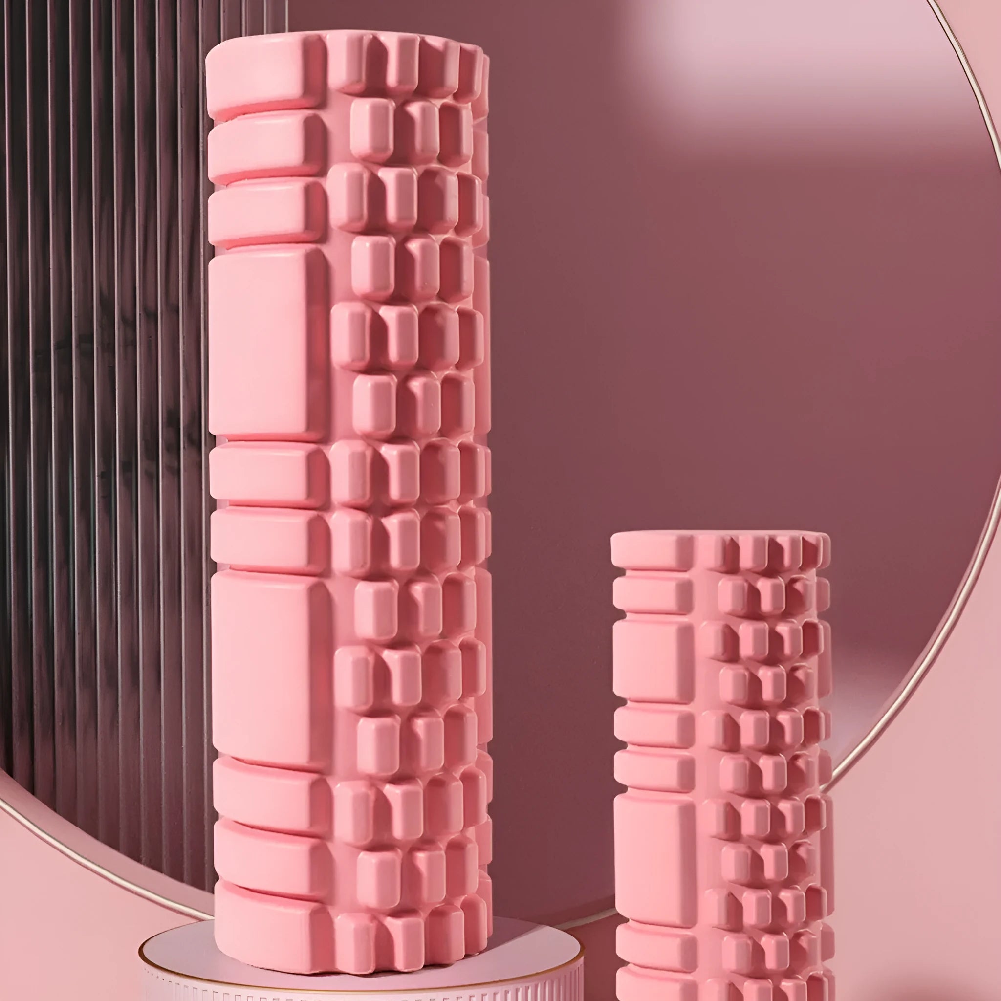 A black EVA foam roller for fitness and muscle recovery, shown alongside pink and sky blue colour options.