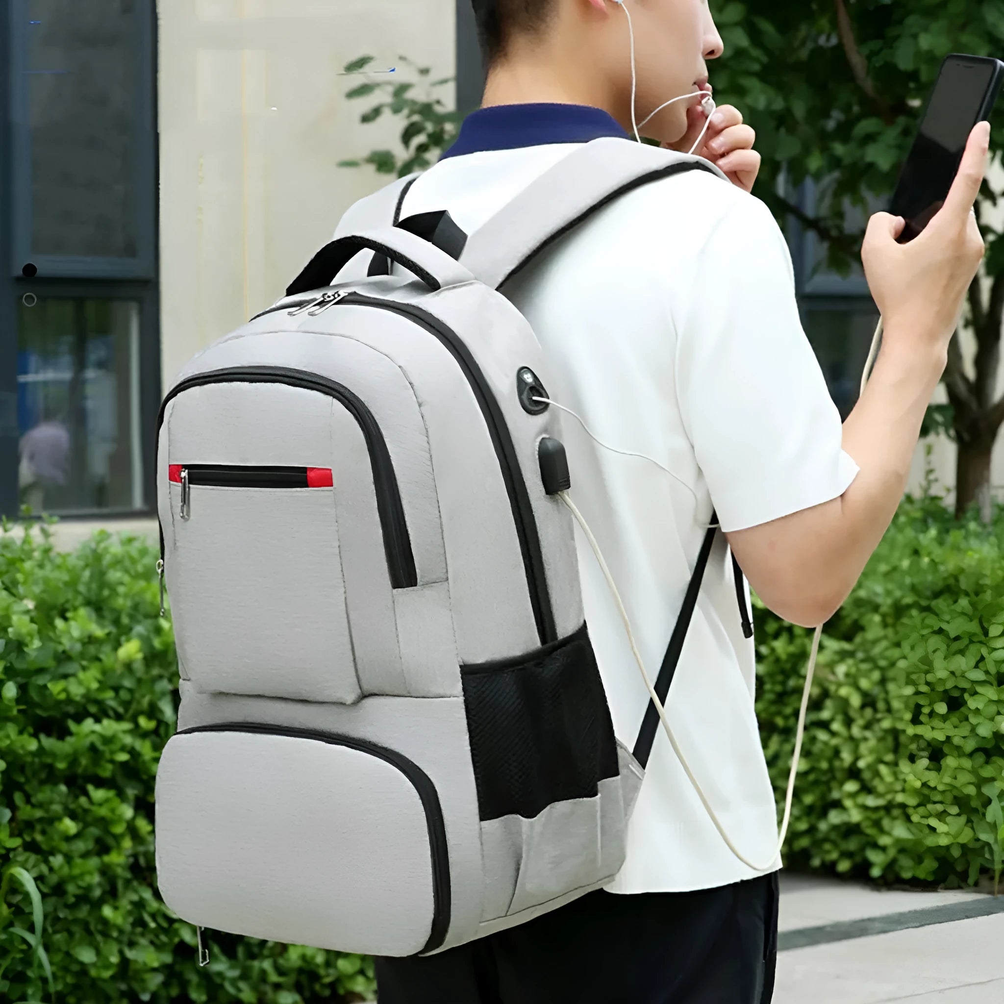 Light grey Oxford cloth insulated backpack with curved shoulder straps and front organisation compartments.