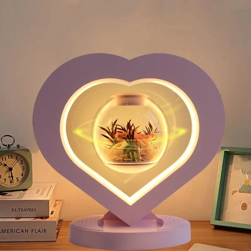 Pink preserved rose in ABS PC PVC ornament with Bluetooth base on tabletop