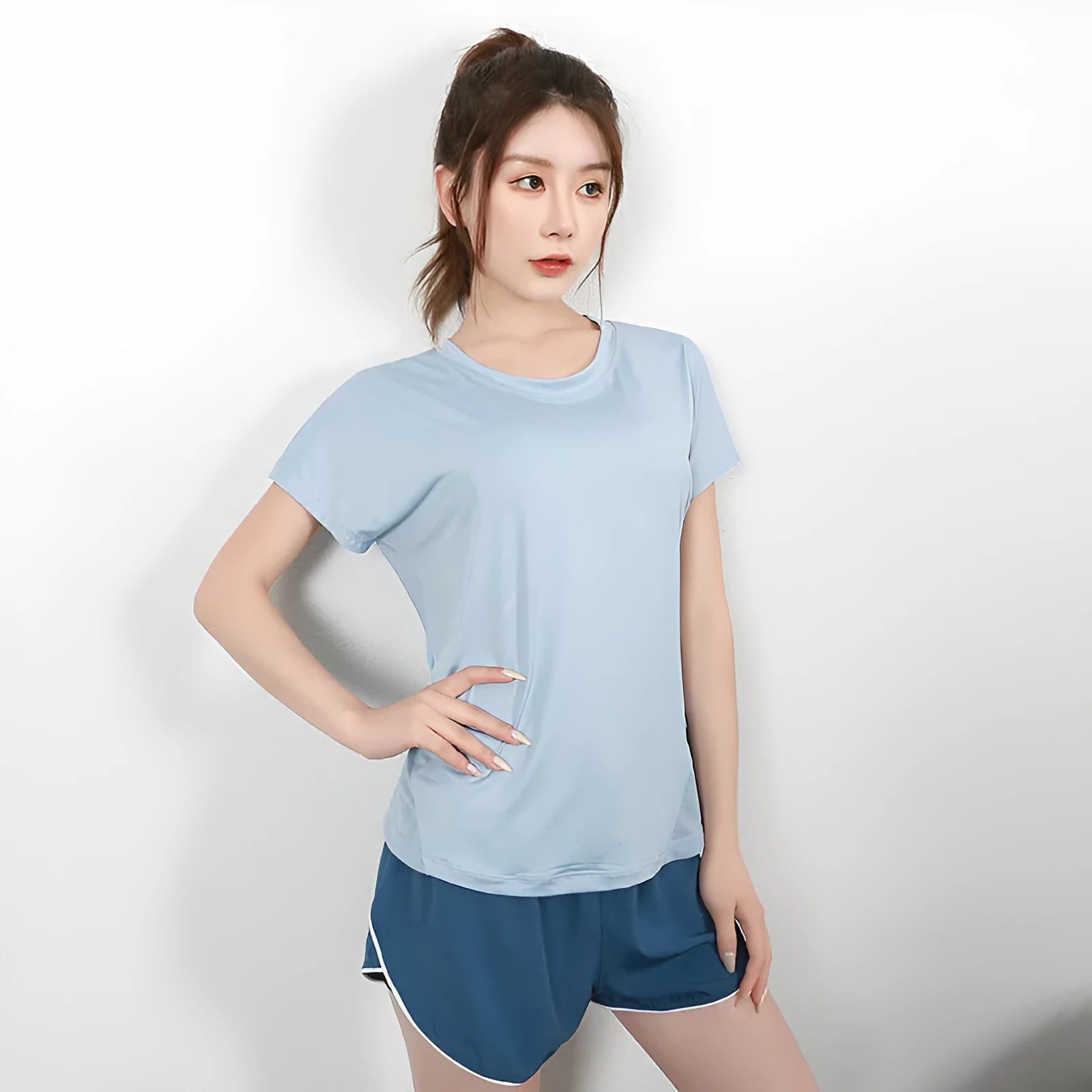 Women's pink short sleeve polyester sports t-shirt for running and fitness.