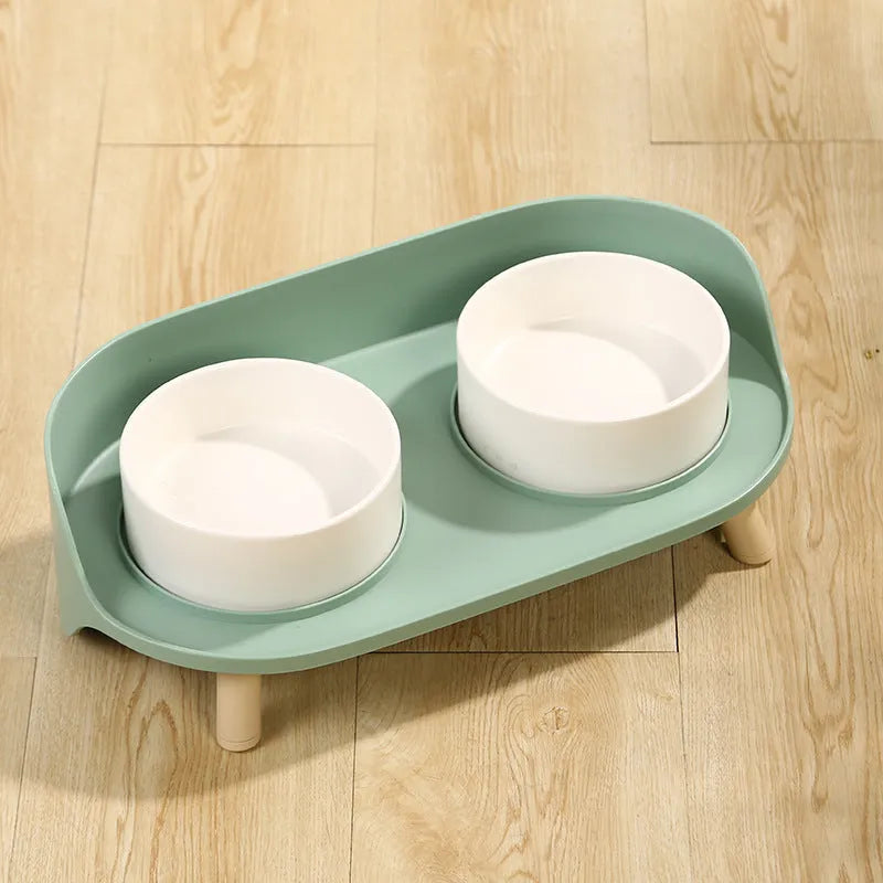 Green tilted double pet bowl set with adjustable angle for cats and small dogs