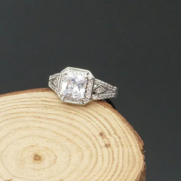 Geometric zircon ring with hollow quadrilateral design in platinum colour on copper band