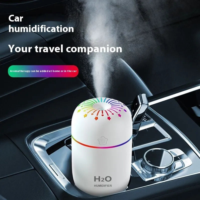 Small white USB desktop humidifier with fireworks design beside measurement showing 75mm width