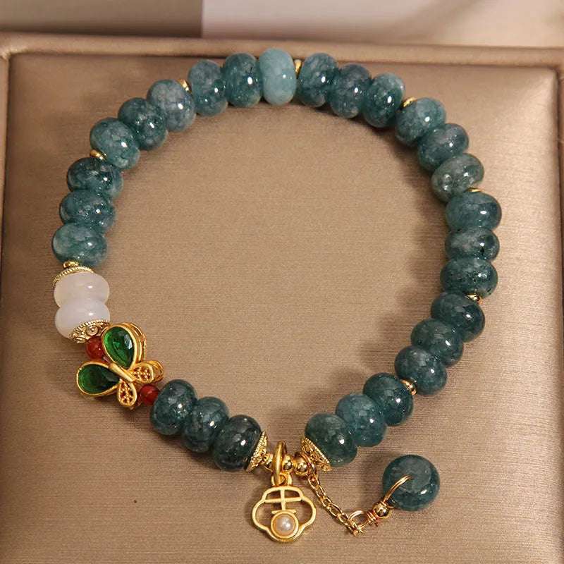 Blue water jade abacus beads crystal bracelet with white agate and butterfly motif on alloy base