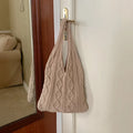 Retro hollow-knitted women's shoulder tote bag in a solid colour with double straps.
