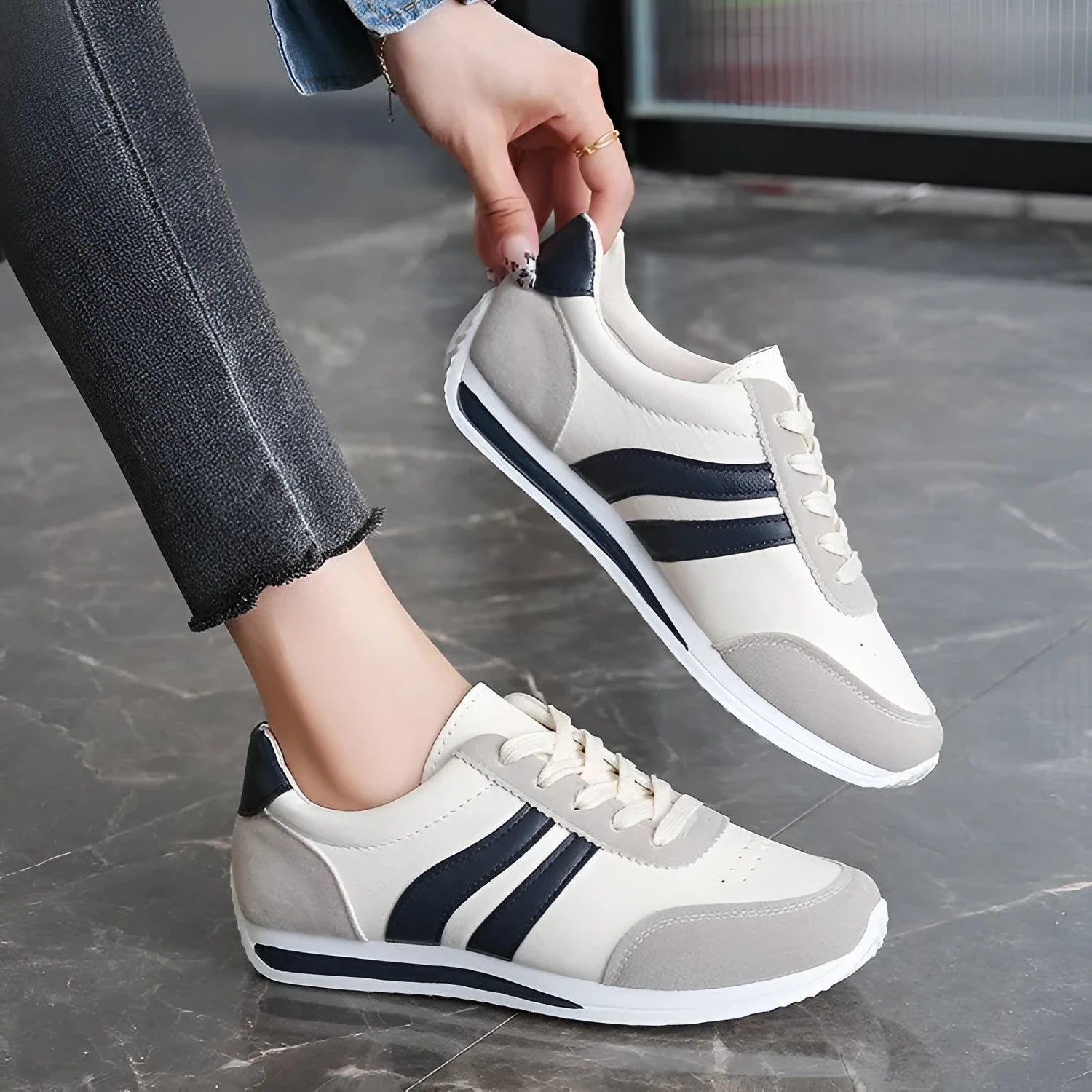 Blue and red lace-up low top sneakers with mesh upper and rubber sole