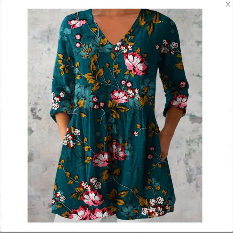 Women's printed loose dress with wide waist and 3/4 length sleeves on a hanger.