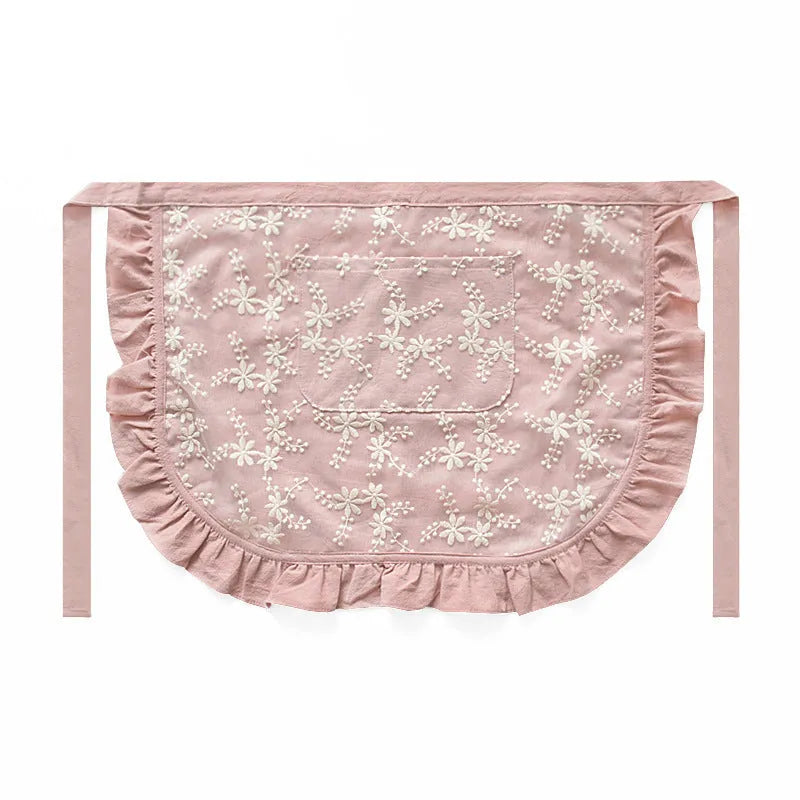 Minimalist cotton linen lace X strap apron in light pink on a white background