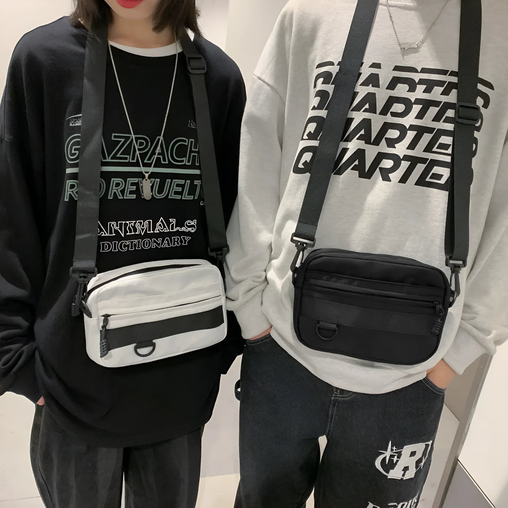 Men's solid colour polyester and nylon crossbody messenger bag shown in black, blue, green, or white.