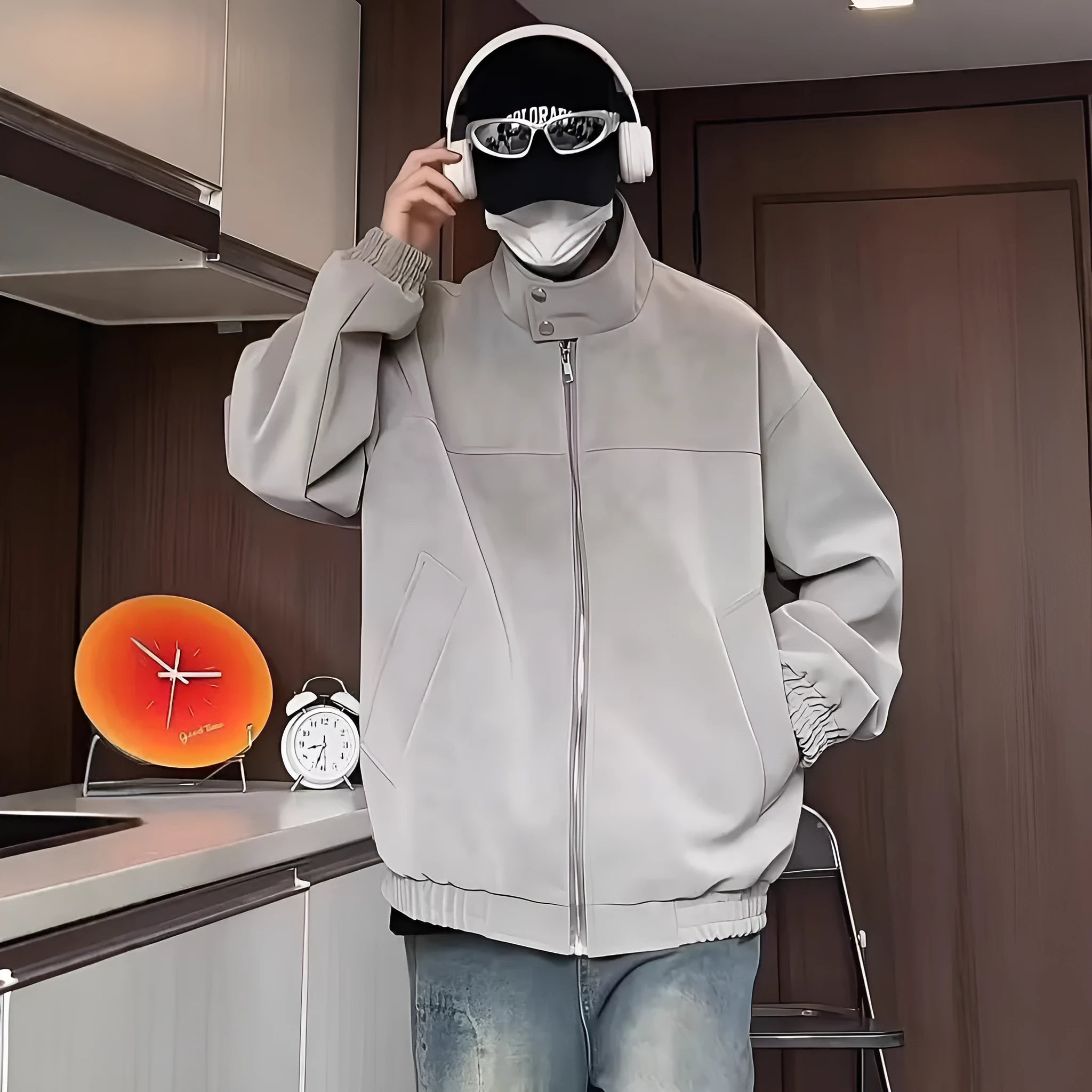 Grey tie-dyed PU leather men's jacket with a stand collar and side pockets on a hanger.
