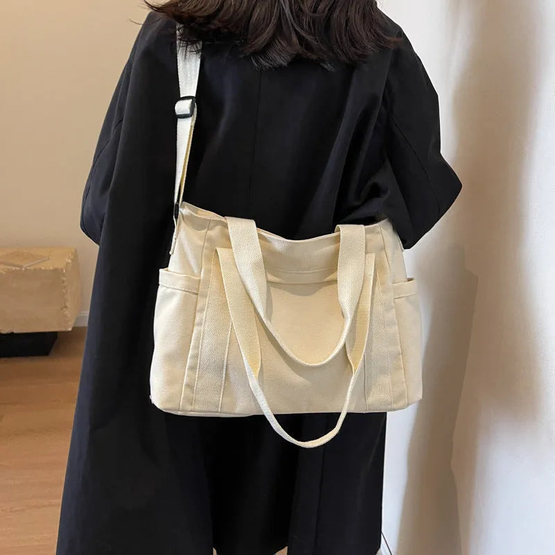 Large capacity shoulder canvas tote bag in solid colour with external sandwich pocket