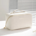 Vertical pattern cubic pillow makeup bag with 22.5 cm dimensions and PU construction