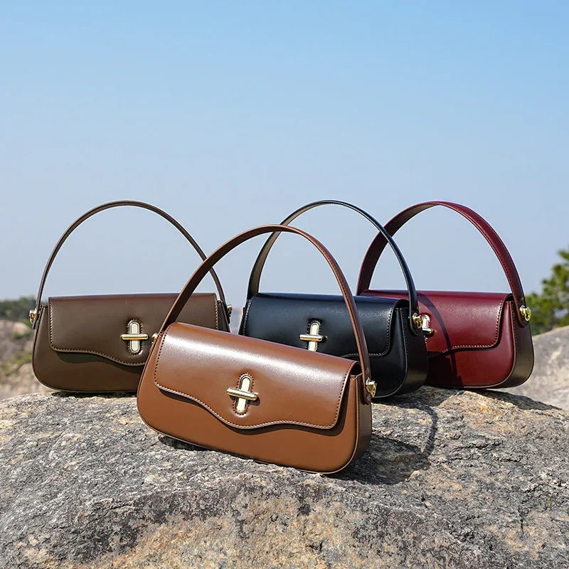 Genuine leather horizontal square baguette bag in black with lock detail