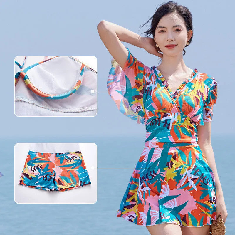 Colourful printed one-piece swimsuit for women available in sizes M to 3XL with belly coverage
